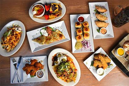 A variety of food items on a table for our SoHo, New York City catering.